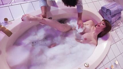 Busty trans wife Izzy Wilde is bathed by her loving husband.The big boobs shemale is jerked